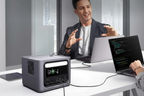 300W power station charging two laptops simultaneously in office