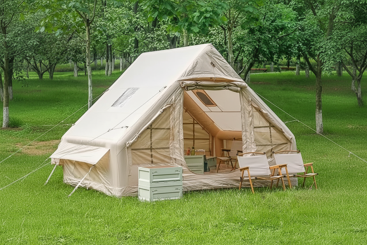 Large beige inflatable ridge tent on green grass with open door showing spacious interior, no text banner